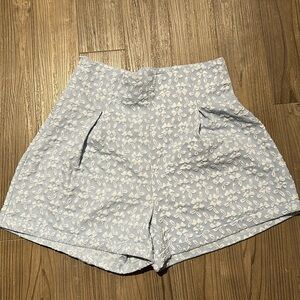 Floral light blue patterned fabric shorts pleated